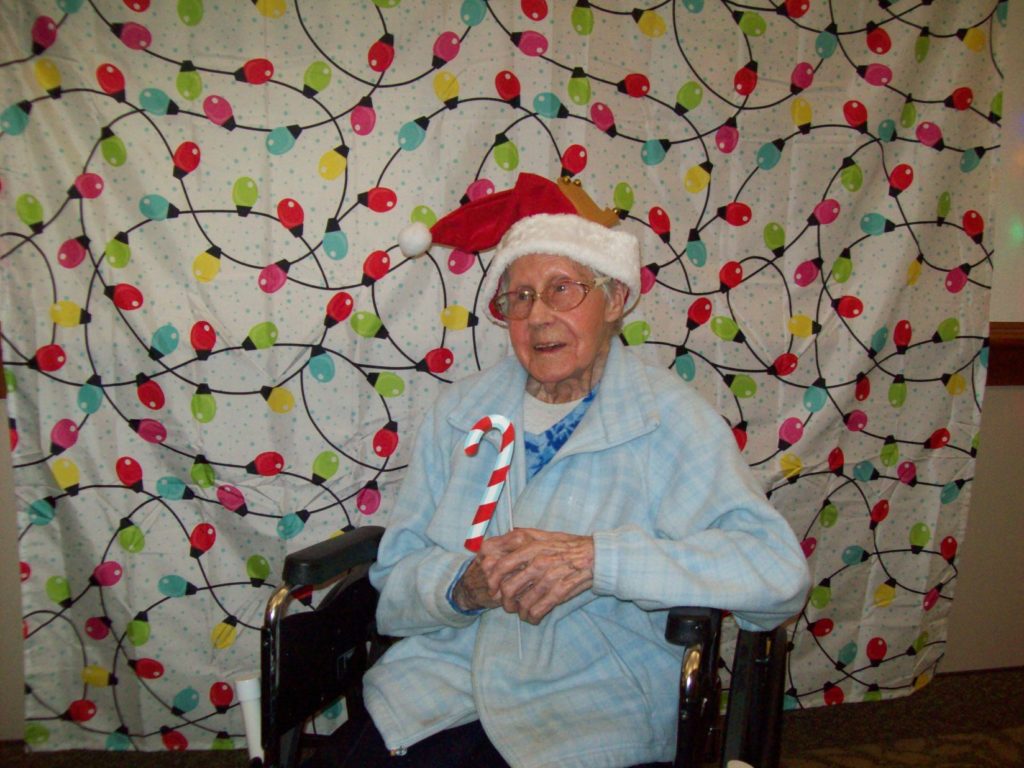 Elderly resident celebrating Christmas at Adams House Assisted Living party